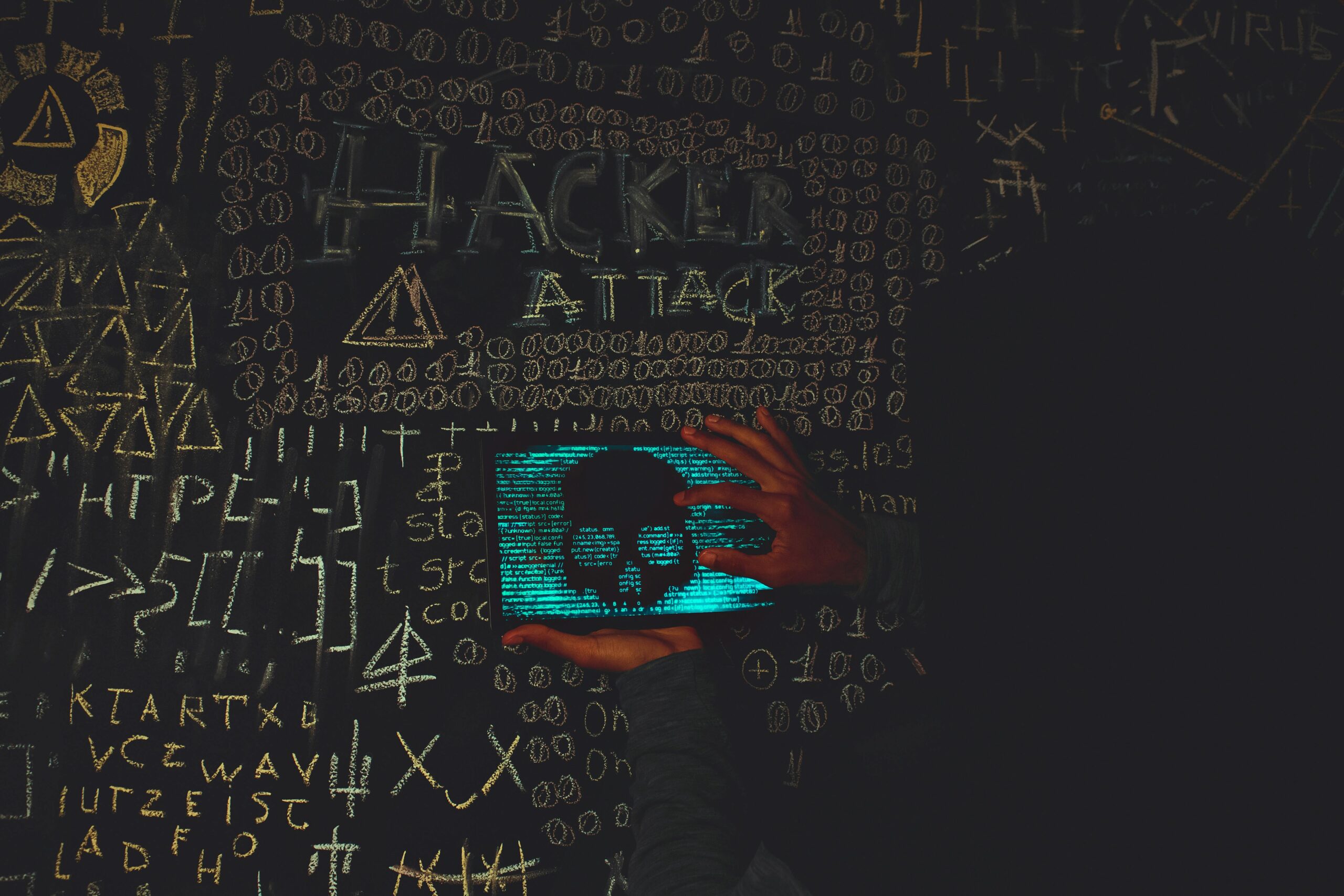 A Person Holding a Tablet Device with Skull Image Near Blackboard